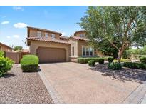 Charming two-story home with a two-car garage, landscaped front yard, and inviting curb appeal at 42 S Nevada Way, Gilbert, AZ 85233
