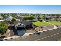 Charming single-story home featuring well-kept landscaping and a convenient attached garage at 5602 N 73Rd Ave, Glendale, AZ 85303