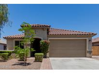 Charming single-story home with a well-manicured front yard and a neutral color scheme at 5659 N 195Th Dr, Litchfield Park, AZ 85340