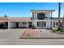 Charming two-story home with a well-maintained front yard and unique architectural details at 7632 E Bonita Dr, Scottsdale, AZ 85250