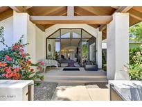 Grand entrance with a full glass door, and a view of the spacious living area, and abundant natural light at 10157 E San Salvador Dr, Scottsdale, AZ 85258