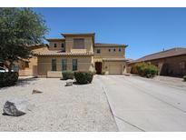 Two-story home featuring desert landscaping, tile roof, and a long driveway leading to a two-car garage at 3088 E Andre Ave, Gilbert, AZ 85298