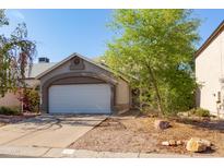 Charming single-story home featuring a two-car garage and a well-maintained, low-maintenance front yard at 3755 E Broadway Rd # 36, Mesa, AZ 85206
