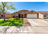 Charming single-story home featuring a well-manicured lawn, two-car garage, and inviting curb appeal at 4837 E Whitehall Dr, San Tan Valley, AZ 85140