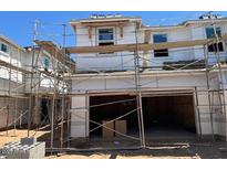 View of exterior of new construction showing garage, windows, and siding at 5843 E Covey Ln, Phoenix, AZ 85054