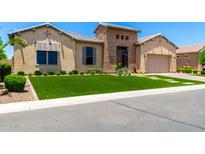 Charming single-story home with desert landscaping and a stylish stone accent entry at 7002 S Portland Ave, Gilbert, AZ 85298