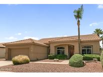 Inviting single-story home showcasing a desert-landscaped yard and a well-maintained tiled roof at 15032 N 54Th Pl, Scottsdale, AZ 85254