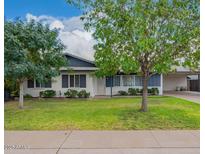 Charming single story home with well maintained front yard and mature trees at 2425 W Shady Glen Ave, Phoenix, AZ 85023
