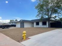 Charming single-story home with low-maintenance desert landscaping, and a welcoming facade at 4415 S Poplar St, Tempe, AZ 85282