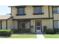 Two-story home with neutral paint, double pane windows, and minimal landscaping at 6029 N 31St Ave, Phoenix, AZ 85017