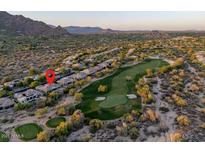 Stunning aerial view of property on the golf course with mountain views at 6481 E Amber Sun Dr, Scottsdale, AZ 85266