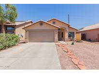Charming single-story home with desert landscaping, two-car garage and covered entryway at 8622 W Shaw Butte Dr, Peoria, AZ 85345