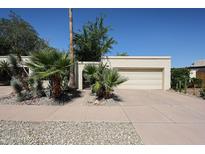 Charming home featuring a two-car garage, desert landscaping, and a gated front entrance at 1500 N Markdale -- # 68, Mesa, AZ 85201