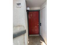Exterior view of unit entry featuring a red front door with the unit number displayed at 1800 W Elliot Rd # 107, Chandler, AZ 85224