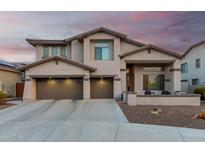 Charming two-story home with a three-car garage and low maintenance front yard at 2336 W Laredo Ln, Phoenix, AZ 85085