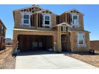 New construction home featuring a two-car garage and a modern design with WaterBlock protection, ready for customization at 27271 N 73Rd Ln, Peoria, AZ 85383