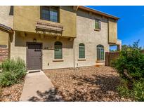 Charming two-story townhome with low maintenance front yard and inviting front entry at 336 N 168Th Dr, Goodyear, AZ 85338