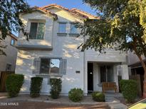 Charming two-story home with a well-maintained front yard and lush landscaping at 3480 E Sheffield Rd, Gilbert, AZ 85296