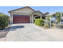Charming single-Gathering home with a two-car garage and well-maintained landscaping at 40060 W Wade Dr, Maricopa, AZ 85138