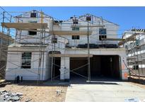 New construction two-story home showing scaffolding and exterior framework details at 7327 W Buckhorn Trl, Peoria, AZ 85383