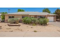 Charming single story home with a desert landscaped front yard and stone accents at 8713 E Rancho Vista Dr, Scottsdale, AZ 85251