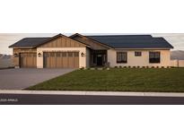 Charming single-Gathering home with a well-manicured lawn and a three-car garage at 11263 E Crescent Ave, Mesa, AZ 85208