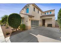 Inviting two-story home featuring a well-manicured front yard and a convenient two-car garage at 1502 E Goldcrest St, Gilbert, AZ 85297