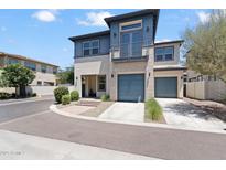 Stunning two-story home with a modern design, balcony, two-car garage, and landscaped front yard at 1555 E Ocotillo Rd # 16, Phoenix, AZ 85014