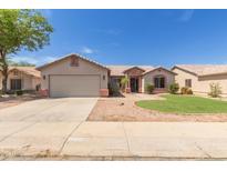 Charming single-story home with a two-car garage and low maintenance desert landscaping at 1642 E Desert Ln, Phoenix, AZ 85042