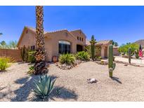 Charming desert-landscaped front yard featuring mature cacti and rock accents at 279 W Stirrup Ln, San Tan Valley, AZ 85143
