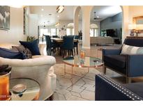Open concept living room with elegant furnishings and an inviting atmosphere for relaxation and entertainment at 136 E Vera Ln, Tempe, AZ 85284