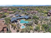 Stunning aerial view of an estate home with a backyard pool and spa, surrounded by lush desert landscaping at 20801 N 90Th Pl # 255, Scottsdale, AZ 85255