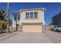 Charming two-story home with a two-car garage and stone accents at 3282 S Warner Dr, Apache Junction, AZ 85120