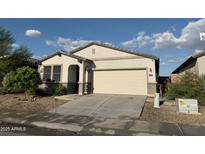 Charming single-story home featuring a two-car garage and low maintenance desert landscaping at 3715 S 57Th Ln, Phoenix, AZ 85043