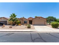 Charming single-story home featuring low-maintenance desert landscaping and a two-car garage at 43581 W Mccord Dr, Maricopa, AZ 85138