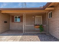 Charming front porch with decorative railing and flower box adds curb appeal at 5204 E Colby St, Mesa, AZ 85205