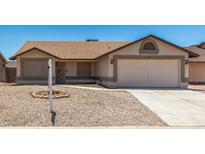 Charming single-story home with a well-maintained front yard and a two-car garage at 6317 E Colby St, Mesa, AZ 85205