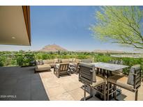 Inviting outdoor patio with cushioned seating and serene views of the nearby mountains at 7117 E Rancho Vista Dr # 6007, Scottsdale, AZ 85251