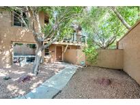 Charming home featuring a small balcony, walkway, and desert landscaping at 10424 N 7Th Pl # 2, Phoenix, AZ 85020