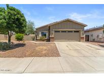 Charming single-story home featuring desert landscaping and a two-car garage at 13796 W Mauna Loa Ln, Surprise, AZ 85379