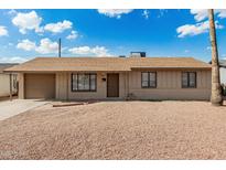 Cozy single-story home featuring a low-maintenance gravel front yard and attached one car garage at 1512 W Crescent Ave, Mesa, AZ 85202