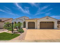 Stunning single-story home featuring a tile roof, manicured lawn and attached garage at 16729 W Alvarado Dr, Goodyear, AZ 85395