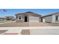 Charming single-story home featuring a low maintenance yard and brick paver driveway and neutral color palette at 18268 W La Senda Dr, Surprise, AZ 85387