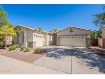Charming single-story home with a well-manicured front yard and three-car garage at 2024 W Darrel Rd, Phoenix, AZ 85041