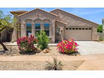 Charming single-Gathering home featuring desert landscaping, a two-car garage, and beautiful stucco architecture at 35314 N 31St Ave, Phoenix, AZ 85086