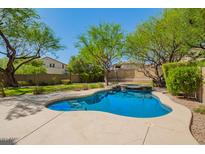 Sparkling backyard pool with lush landscaping and a serene setting, perfect for relaxation and entertainment at 3818 E Quail Ave, Phoenix, AZ 85050