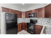 Updated kitchen boasts modern appliances, sleek countertops, and ample cabinet space at 5704 E Aire Libre Ave # 1093, Scottsdale, AZ 85254