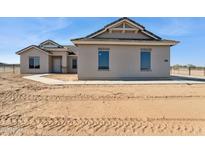New construction home showcasing a neutral color scheme and simple landscaping at 11215 E Crescent Ave, Mesa, AZ 85208