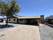 Charming single-story home with a spacious driveway and desert landscaping at 11849 N 29Th Ave, Phoenix, AZ 85029