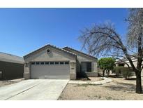 Charming single-story home with a two car garage and a well-maintained front yard at 14700 N El Frio St, El Mirage, AZ 85335
